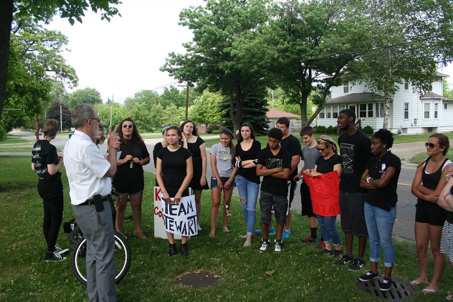 Superintendent Barry Martin addresses the students who protested the proposed counselor changes. Nearly 40 students gathered, most wearing black, to support the MPS counselors.