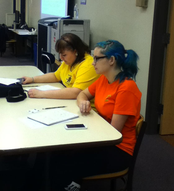 Seniors Maggie Apple and Kali Loggins participate in the writing marathon on Friday Nov. 7. They were writing six word memoirs during this time and having tons of fun.
