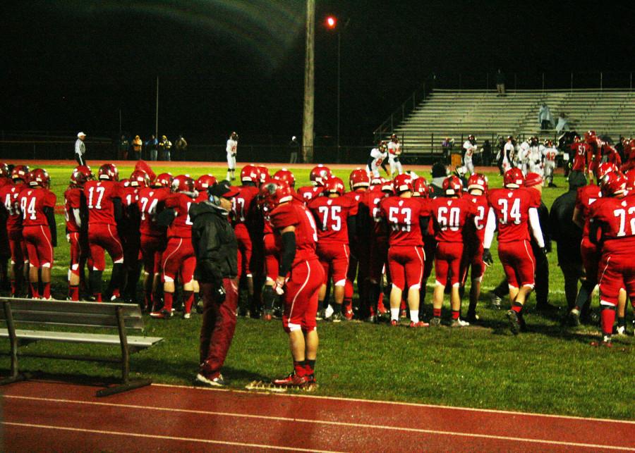 Monroe Varsity football team gets ready to take the field during a time out at the first round of state playoffs held at MHS Oct. 31. Monroe won against Dearborn 47-15.