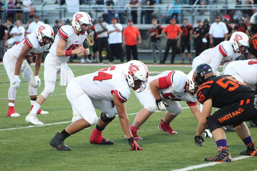 Senior Offensive Lineman Armando Flores and Troy Vajcner prepare to block the Tecumseh Indian’s defensive line. The Trojans defeated the Indians 47-13. 