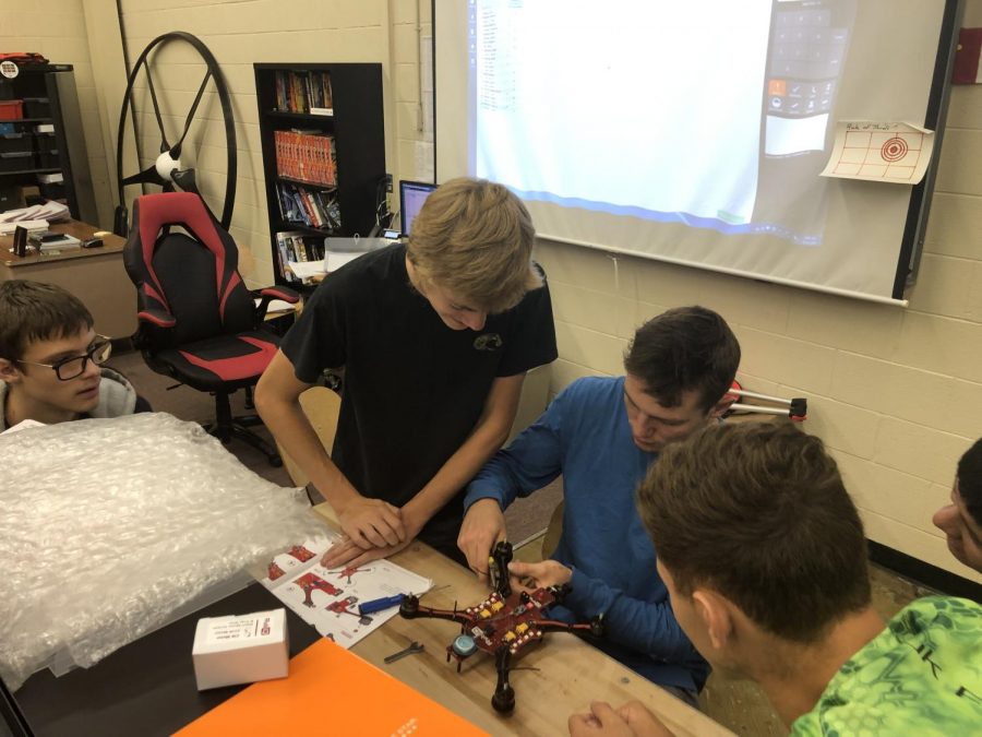 Senior John Kohler and Wyatt Head work on a UAV. The new Electro-Mechanical Drone Design class serves as a math credit for seniors.