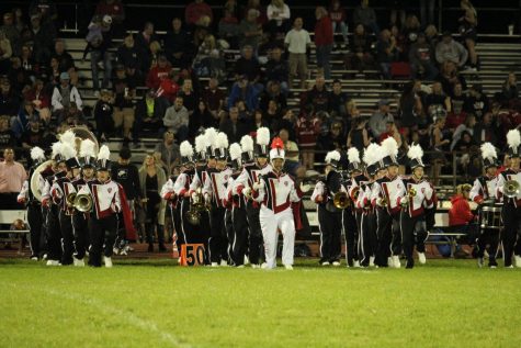 The Trojan Marching Band begins their trek across the field for the homecoming halftime show. They began with a rendition of popular pop songs.