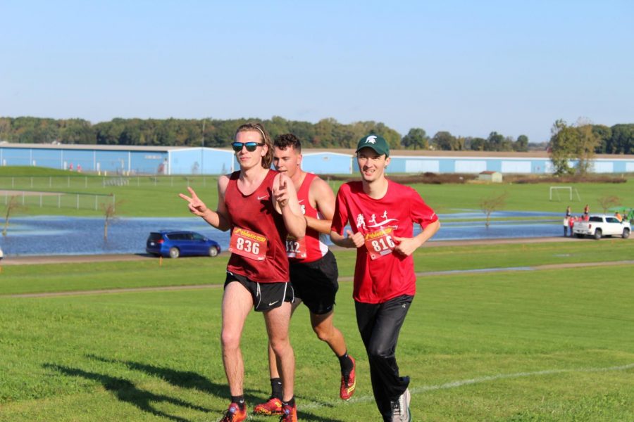 Alumni Jake Maas, Matthew Parran, and Craig Latty stick together to finish the race. They were all on the cross country team during their years at MHS.
