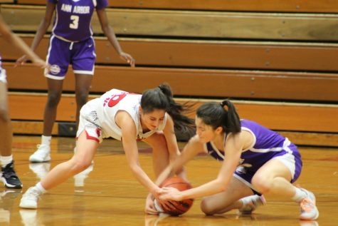 Sophomore Brooklin Stahl fights for possession of the ball against an opposing player. Monroe had a total of seven fouls.
